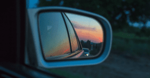 Looking in rear view mirror