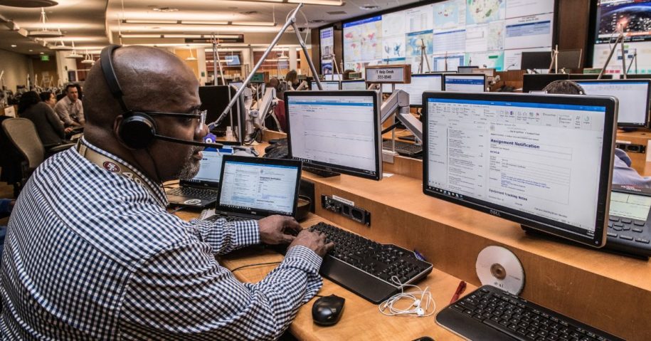 Man working on desktops in operations center
